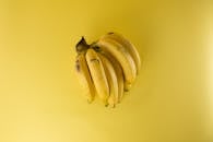 pexels-photo-61127-61127 A vibrant bunch of ripe bananas on a matching yellow background, evoking freshness.